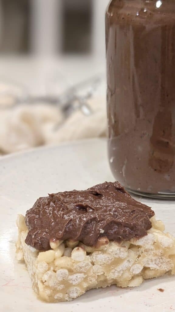 Image of Chocolate Tahini Buttercream Frosting on a rice Krispie treat